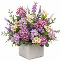 Arrangement floral artificiel en violet, rose et crème dans un pot carré