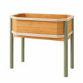 Jardinière surélevée en bois avec pieds métalliques verts
